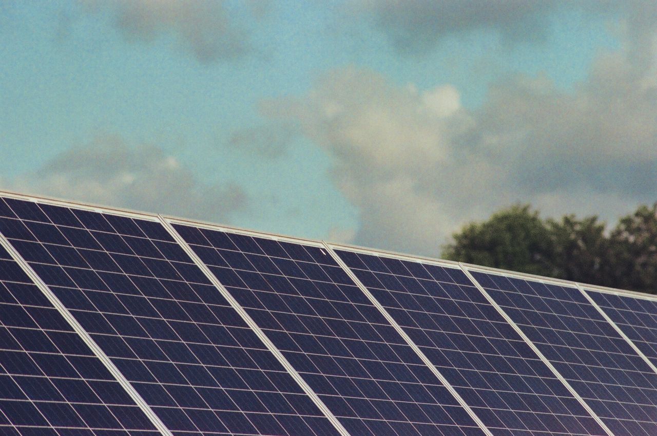 Crafting Captivating Headlines: Your awesome post title goes here Photograph of solar panels capturing renewable energy under a blue sky, promoting sustainability and environmental protection.